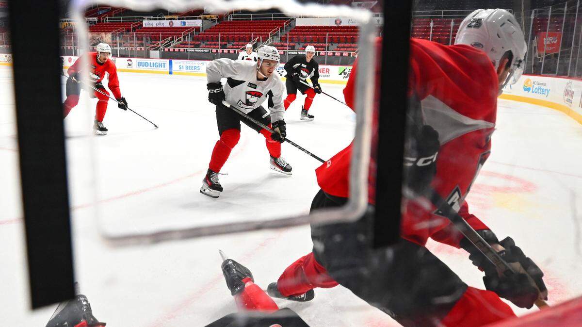 Charlotte Checkers players follow the puck during practice on Thursday, October 12, 2023. The Checkers open their AHL season on Friday night at Bojangles Coliseum in Charlotte, NC.