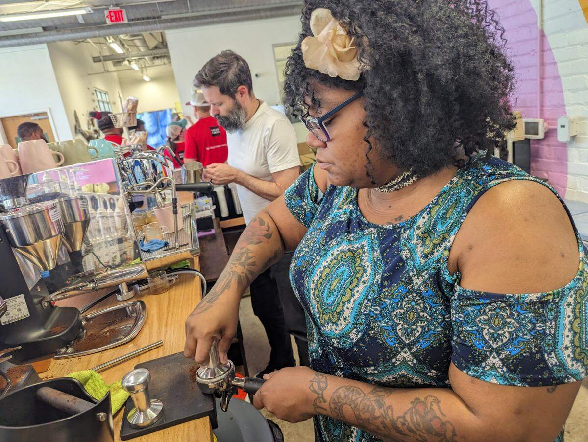 Monique Mims is the first trained barista at Change Please Coffee in Charlotte, a nonprofit that helps women experiencing homelessness.