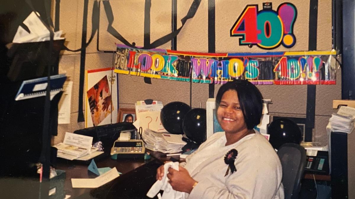 Zelda Keitt at one of her desks at the Arts & Science Council, at a surprise party for her 40th birthday. “She cared about people,” a colleague said.