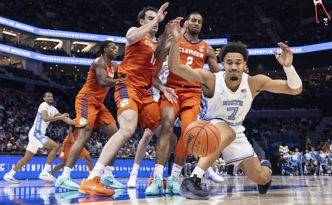 North Carolina guard Seth Trimble (7) fumbles the ball out of bounds under pressure from the Clemson defense in the first half Thursday.