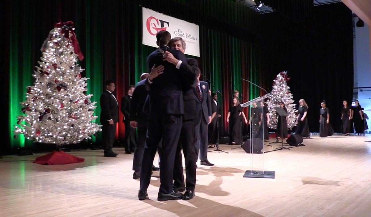 Malcolm E. Everett, III, center, President, The Good Fellows Club, gets a hug from Jay Everett of Calvary Chapel Church, in Chattanooga, TN, near the conclusion of the 102nd annual Good Fellows Club Christmas Luncheon in the Crown Ballroom of the NASCAR Hall of Fame on Wednesday, December 12, 2018. The event raises money for local families in emergency need throughout the year, primarily with rent and utility payments to keep them from living on the streets. Founded in 1917, the Good Fellows Club has about 1,700 members in the greater Charlotte area, men who’ve raised $3.6 million in the past five. The club assisted 2,479 families in 2017.