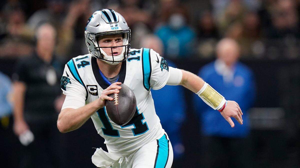 Carolina Panthers quarterback Sam Darnold (14) scrambles in the first half of an NFL football game against the New Orleans Saints in New Orleans, Sunday, Jan. 2, 2022. (AP Photo/Gerald Herbert)