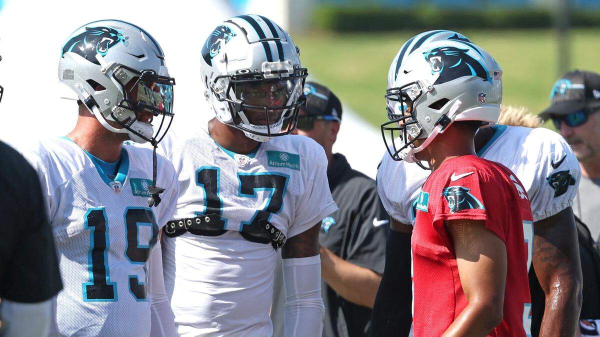 Carolina Panthers quarterback Bryce Young, right, talks to wide receivers Adam Thielen (19) and DJ Chark (17) prior to a drill during the team’s joint practice with the New York Jets on Wednesday, August 9, 2023 at Wofford College in Spartanburg, S.C.