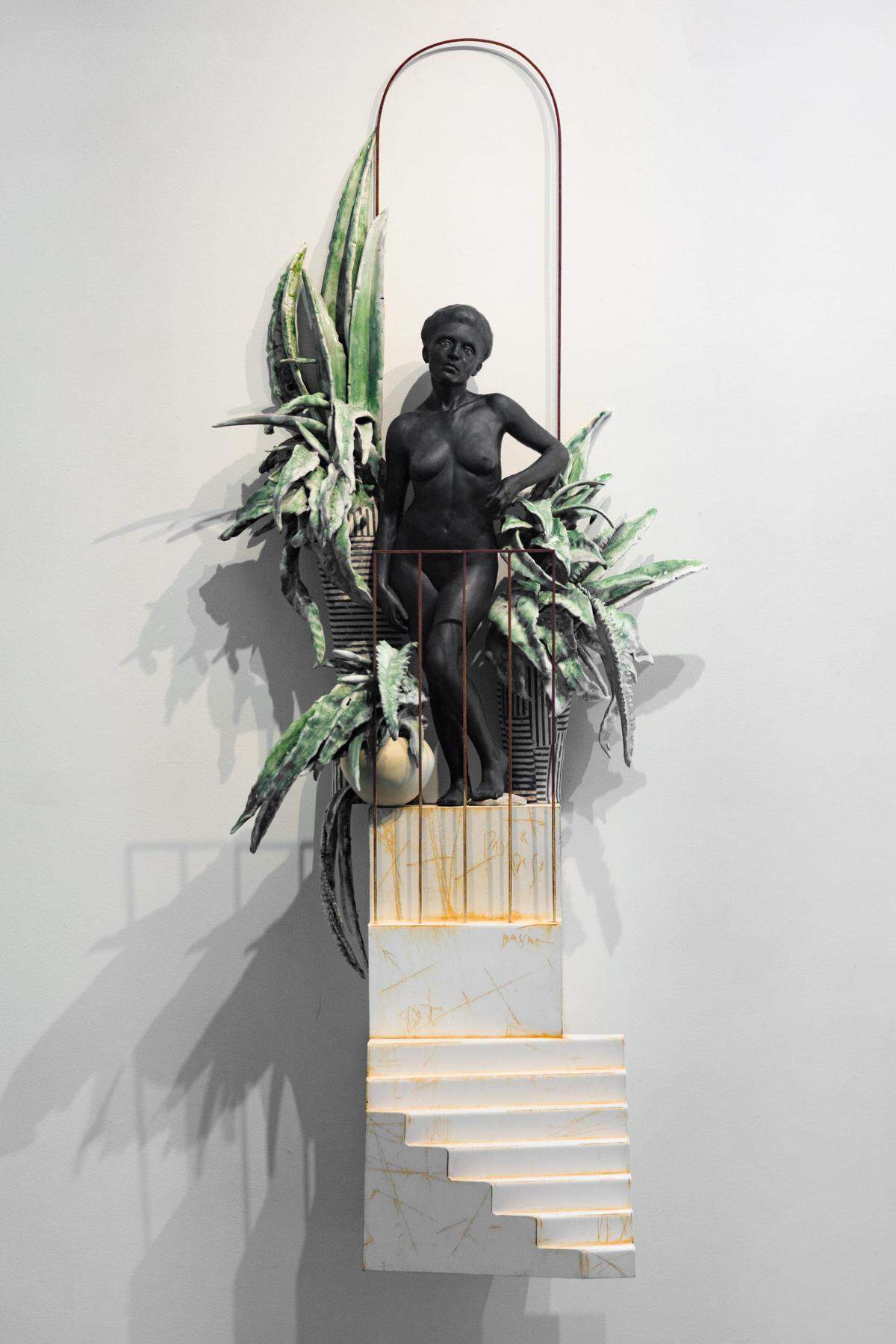 Cristina Córdova included metalwork into this ceramic figure of a woman at the top of a staircase. It’s among 11 new works she has on display at Hodges Taylor.