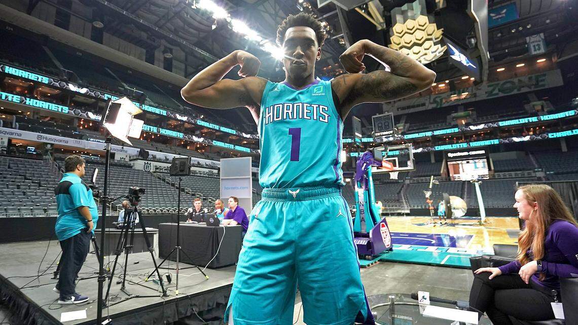 Charlotte Hornets guard Malik Monk flexes his muscles during the team’s media day.