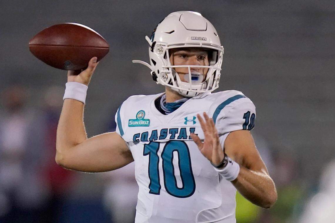 Coastal Carolina quarterback Grayson McCall (10) passes to a teammate during the first half of an NCAA college football game against Kansas in Lawrence, Kan., Saturday, Sept. 12, 2020. (AP Photo/Orlin Wagner)