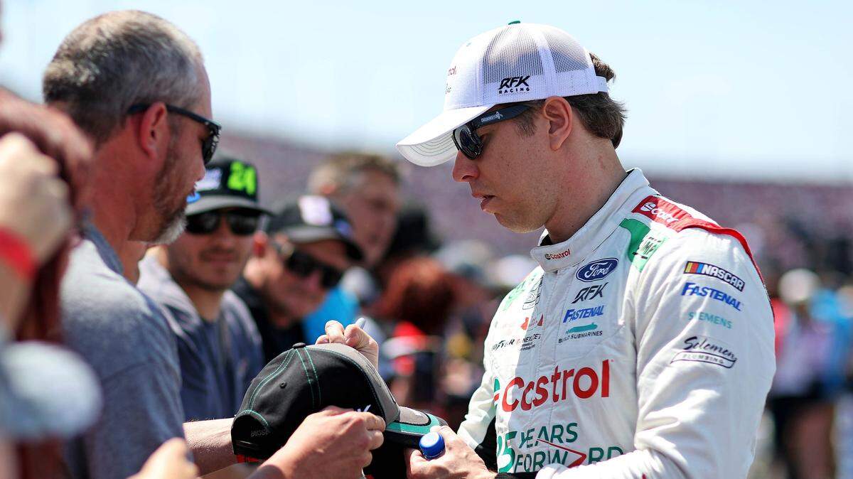 NASCAR Cup Series driver Brad Keselowski (6) greets fans before the Goodyear 400 at Darlington Raceway.