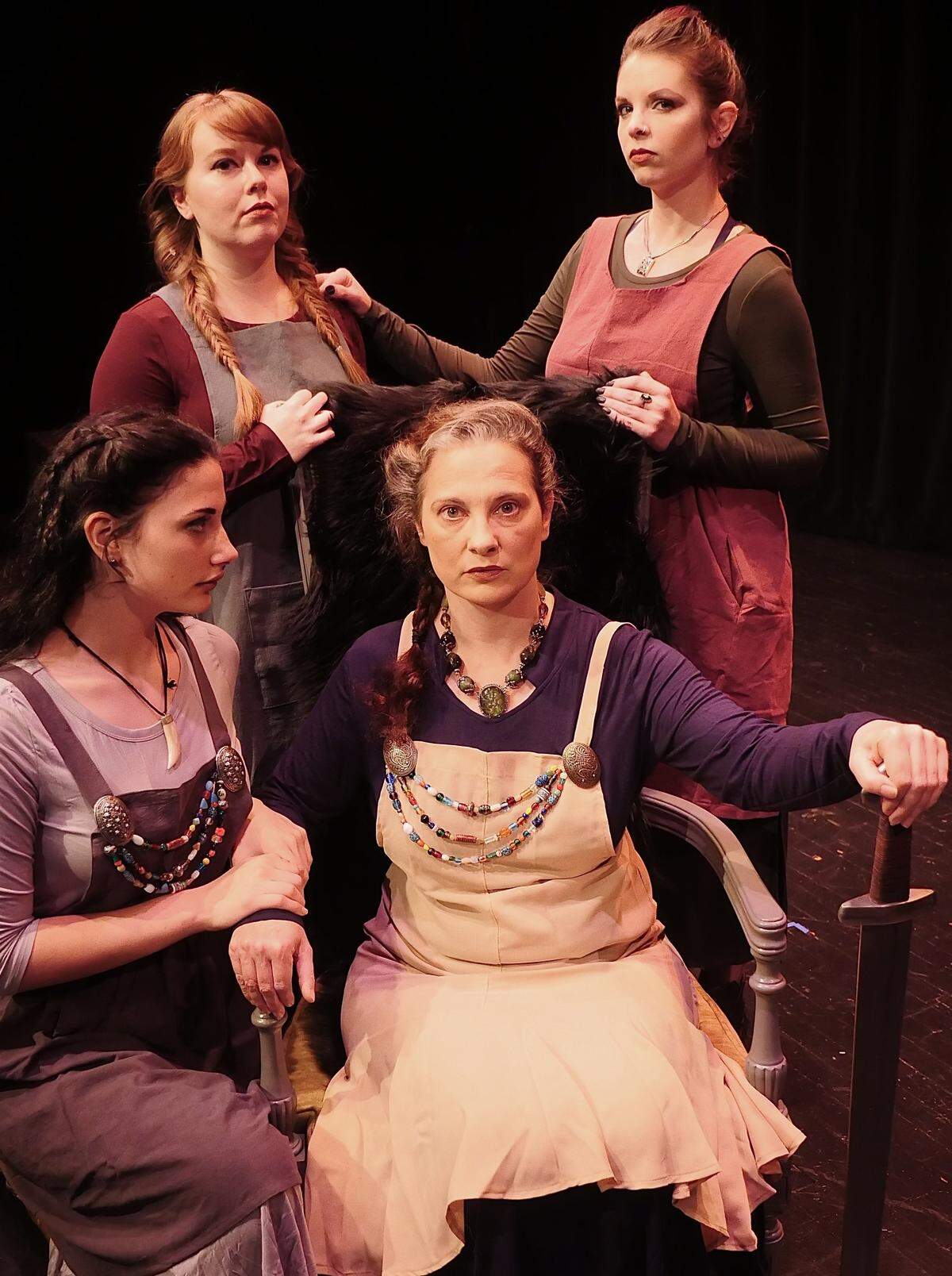 These are members of cast of Free Reign Theatre’s “Lear.” Left to right, Lisa Essex plays Lear and her daughter Madeleine Essex plays Lear’s daughter, Cordelia. Also pictured are cast members Rebecca Gossage (Reagan) and Kristin Varnell (Goneril).