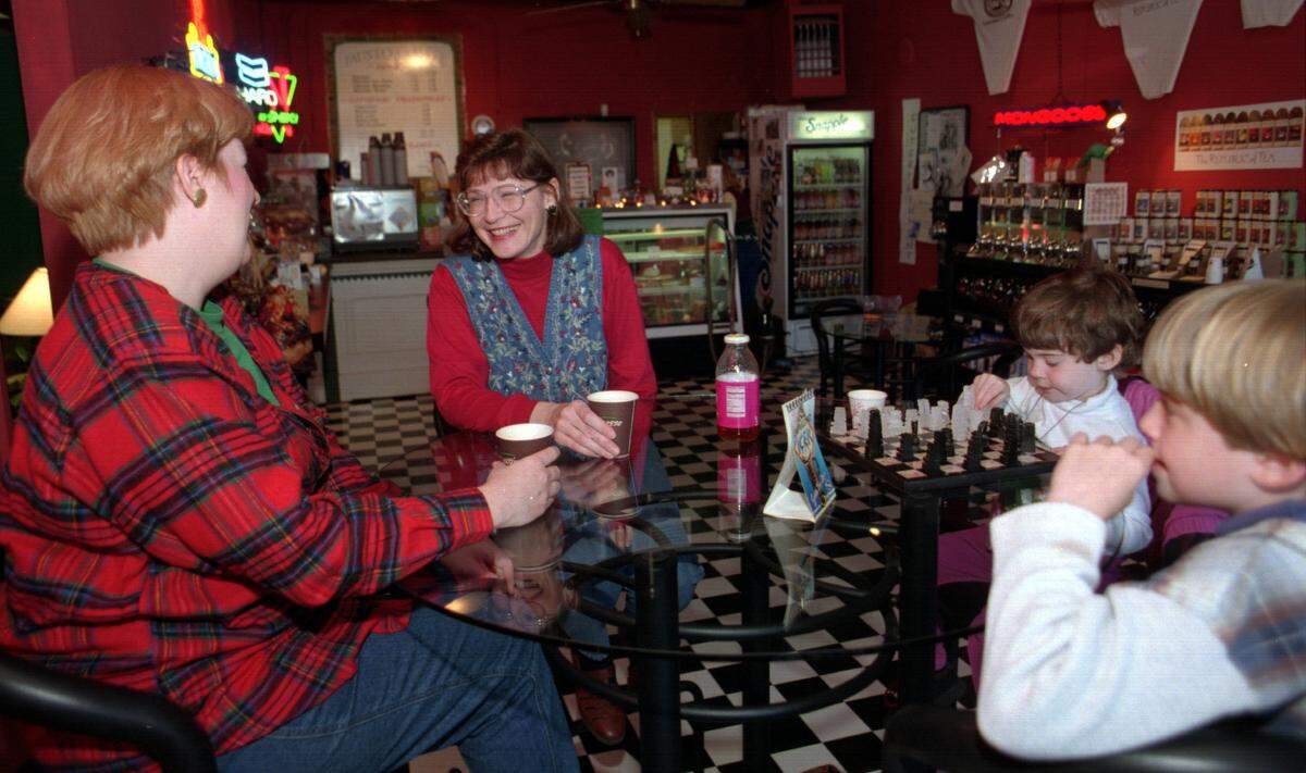 At Fausto Coffee Shop in Lincolnton in Dec. 1996, patrons stop to sip and chat between errands. They are, from left, Kathy Berkowitz, Vicki Holder, Amy Holder, 3, and Sara Holder, 9, all of Hickory.