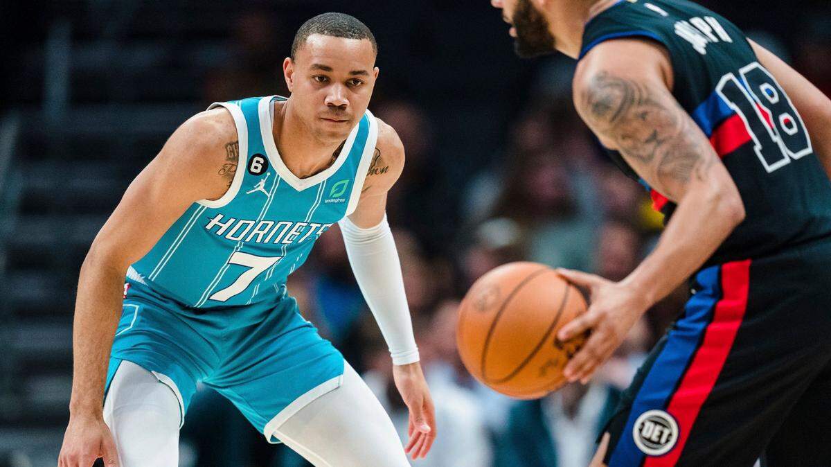 Charlotte Hornets guard Bryce McGowens (7) guards against Detroit Pistons guard Cory Joseph (18) during the second half of an NBA basketball game in Charlotte, N.C., Monday, Feb. 27, 2023. (AP Photo/Jacob Kupferman)