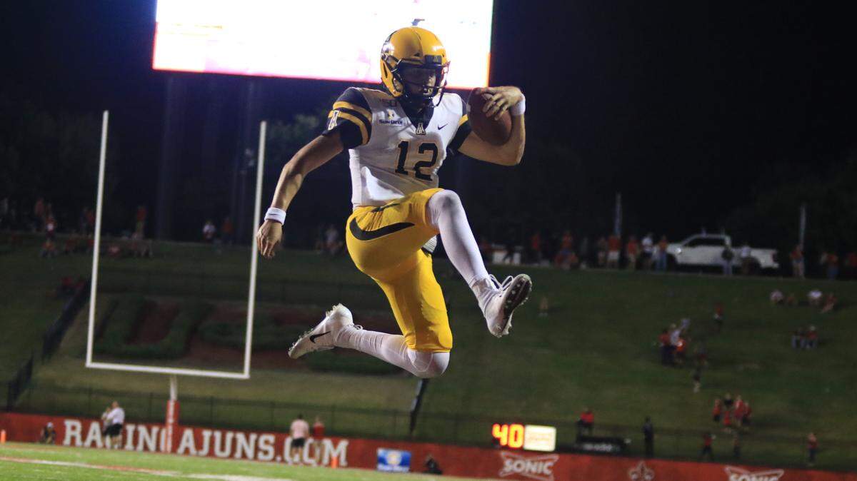 Appalachian State quarterback Zac Thomas, shown scoring one of his touchdowns against Louisiana last week, is a finalist for the Johnny Unitas Golden Arm Award. He leads the Mountaineers against Louisiana Monroe on Saturday.