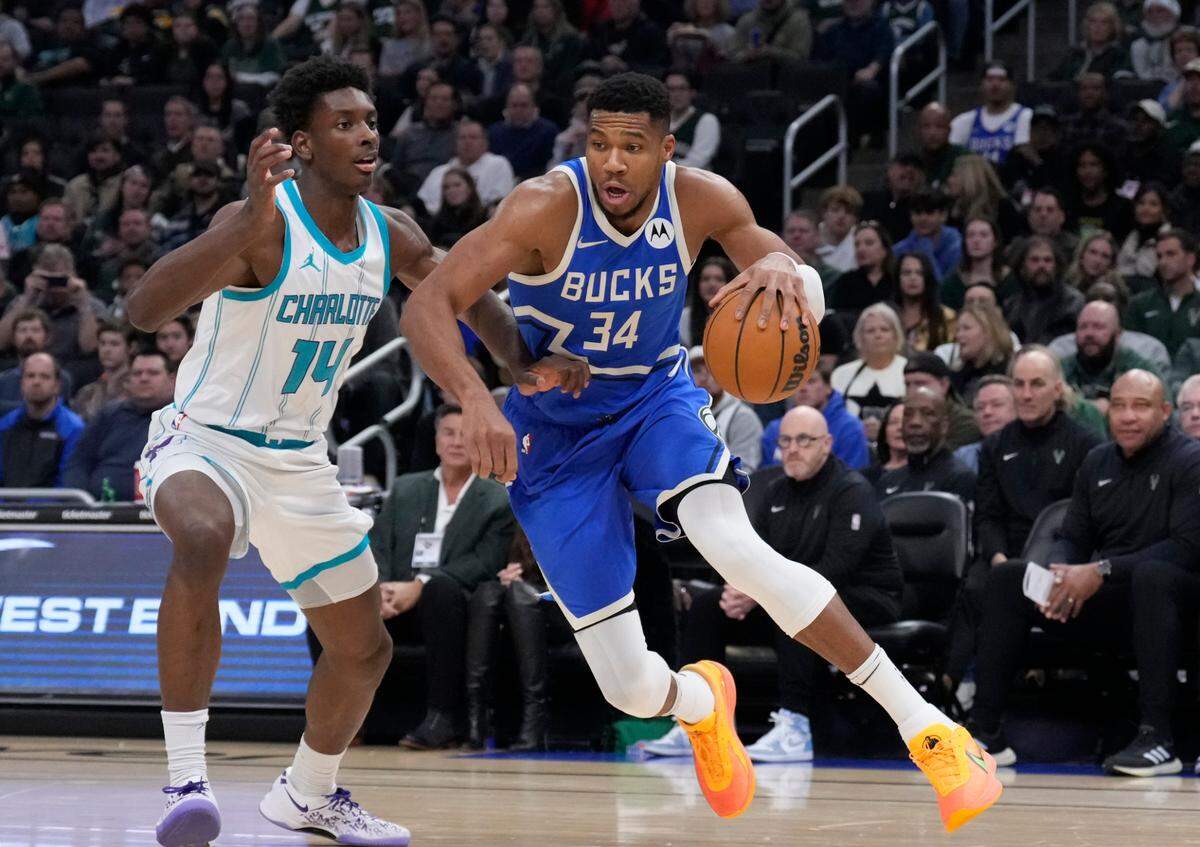 Nov 23, 2024; Milwaukee, Wisconsin, USA; Milwaukee Bucks forward Giannis Antetokounmpo (34) drives to the basket against Charlotte Hornets forward Moussa Diabate (14) in the first half at Fiserv Forum. Mandatory Credit: Michael McLoone-Imagn Images