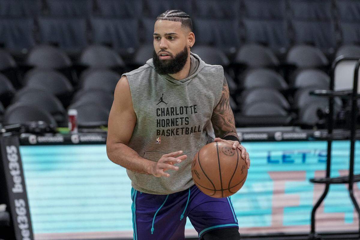 Charlotte Hornets forward Cody Martin (11) during pregame warmups against the Philadelphia 76ers at Spectrum Center.