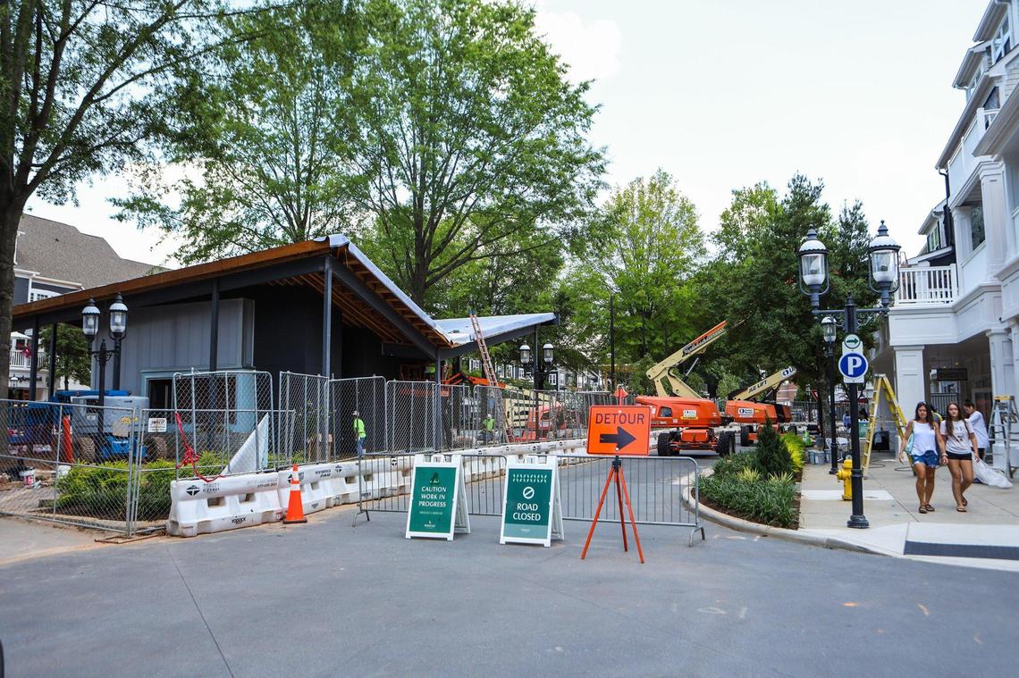 Construction is underway Friday for new structures at Birkdale Village including a concierge building behind the covered stage at The Plaza.