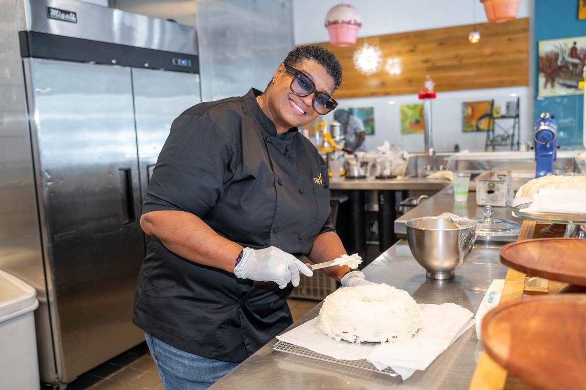 Velvet Kelty-Jacobs makes a red velvet cake at VelTree in 2022. The restaurant closed in late 2022, citing the ongoing pandemic.