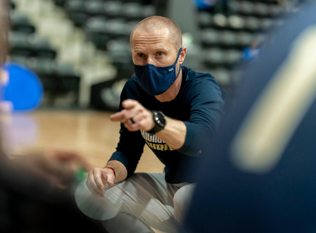 Hickory Grove head coach Jim Rhodes (center) talks with his team during a late 1st half timeout at the Phenom Holiday Classic Wednesday December 23, 2020.