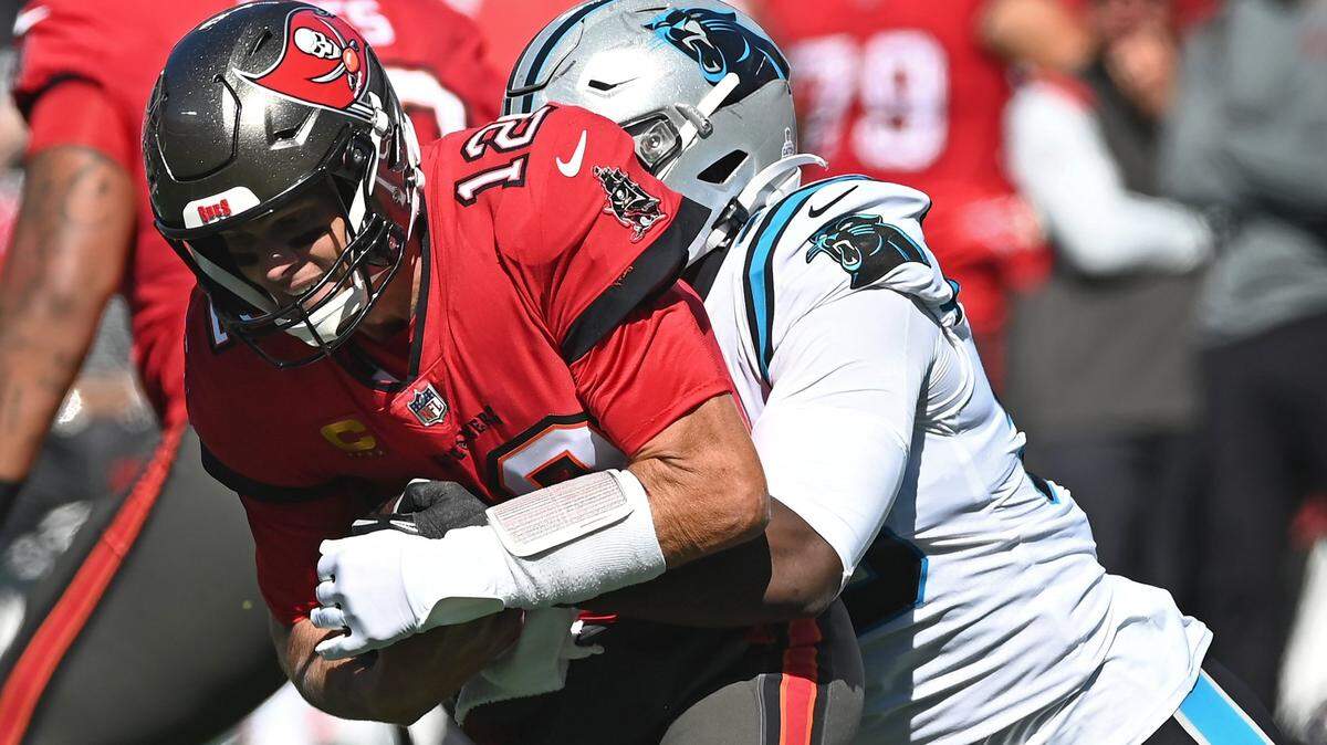 Carolina Panthers defensive end Brian Burns sacks Tampa Bay Buccaneers quarterback Tom Brady during second quarter action at Bank of America Stadium in Charlotte, NC on Sunday, October 23, 2022.