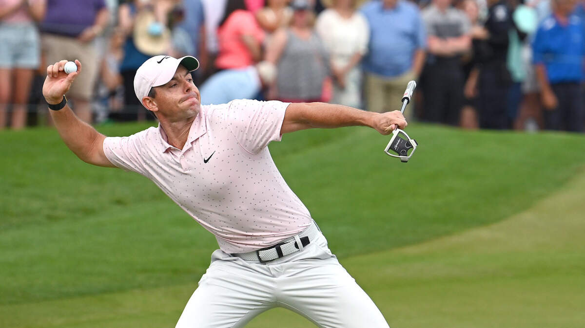 Golfer Rory McIlroy turns and throws his ball toward the crowd after winning the Wells Fargo Championship at Quail Hollow Club in Charlotte on Sunday. It was McIlroy’s third win at the tournament, which he also took in 2010 and 2015.