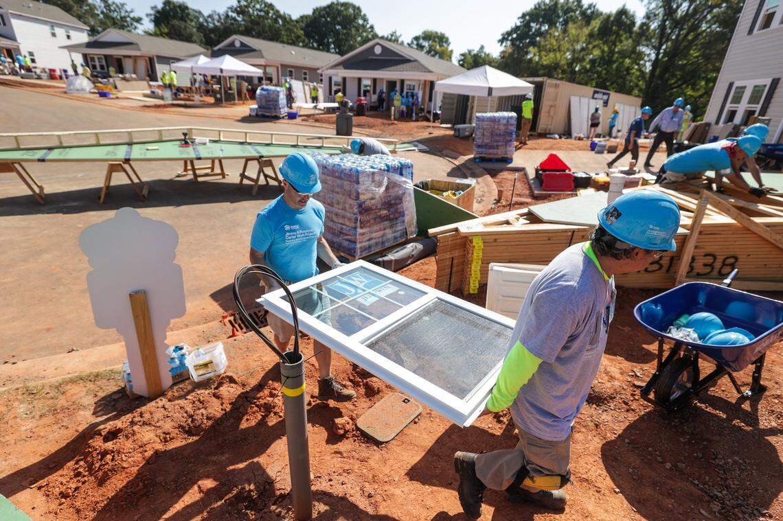 Volunteers work on 27 homes for the 2023 Jimmy & Rosalynn Carter Work Project in the Meadows at Plato Price development in Charlotte.