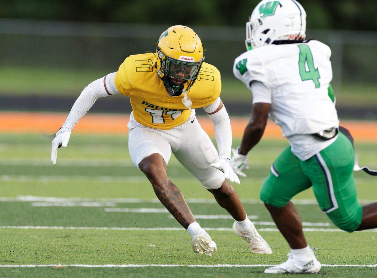 Independence High School junior Nick Reddish (left) lines up at safety during a preseason scrimmage against Weddington on Aug. 15, 2025