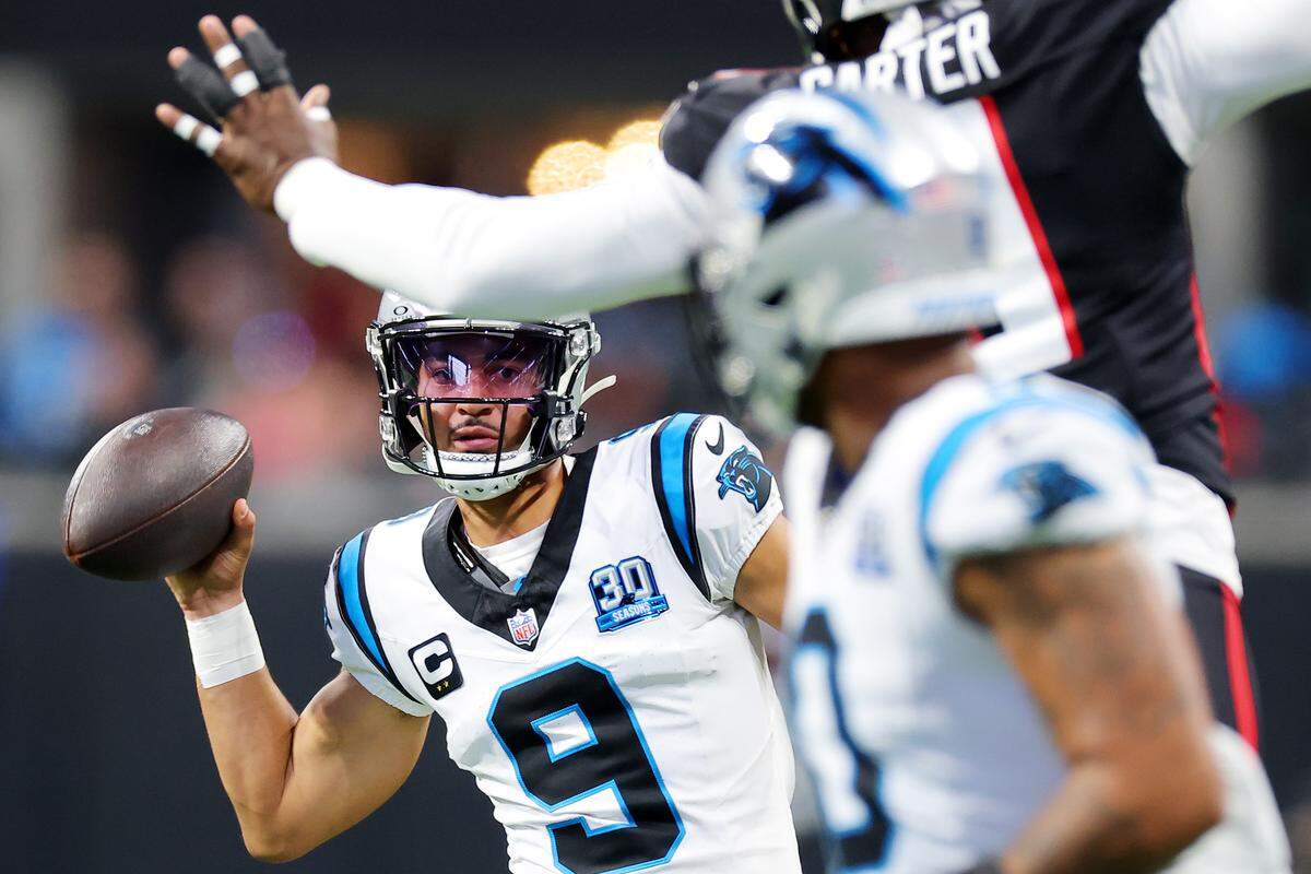 Bryce Young of the Carolina Panthers looks to pass against the Atlanta Falcons during the second quarter at Atlanta’s Mercedes-Benz Stadium on Jan. 5, 2025.