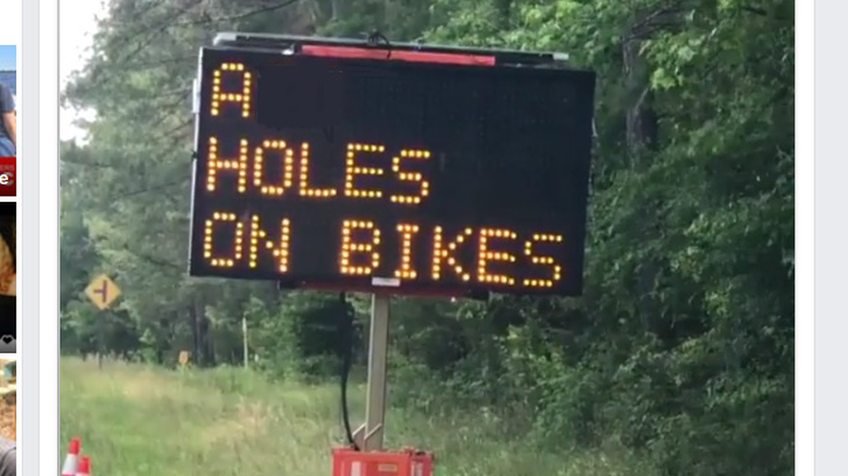 Bicyclist Eugene Caffrey saw this sign along the side of the road while biking near Raleigh on Sunday. A portion of the sign has been blacked out for publication.