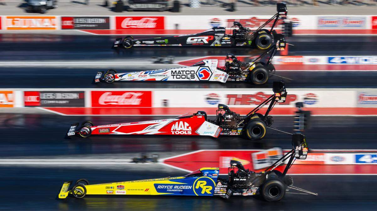 Apr 11, 2025; Las Vegas, NV, USA; NHRA top fuel dragster drivers (from bottom) Tony Stewart alongside Doug Kalitta, Antron Brown and Brittany Force during qualifying for the Four Wide Nationals at The Strip at Las Vegas Motor Speedway.