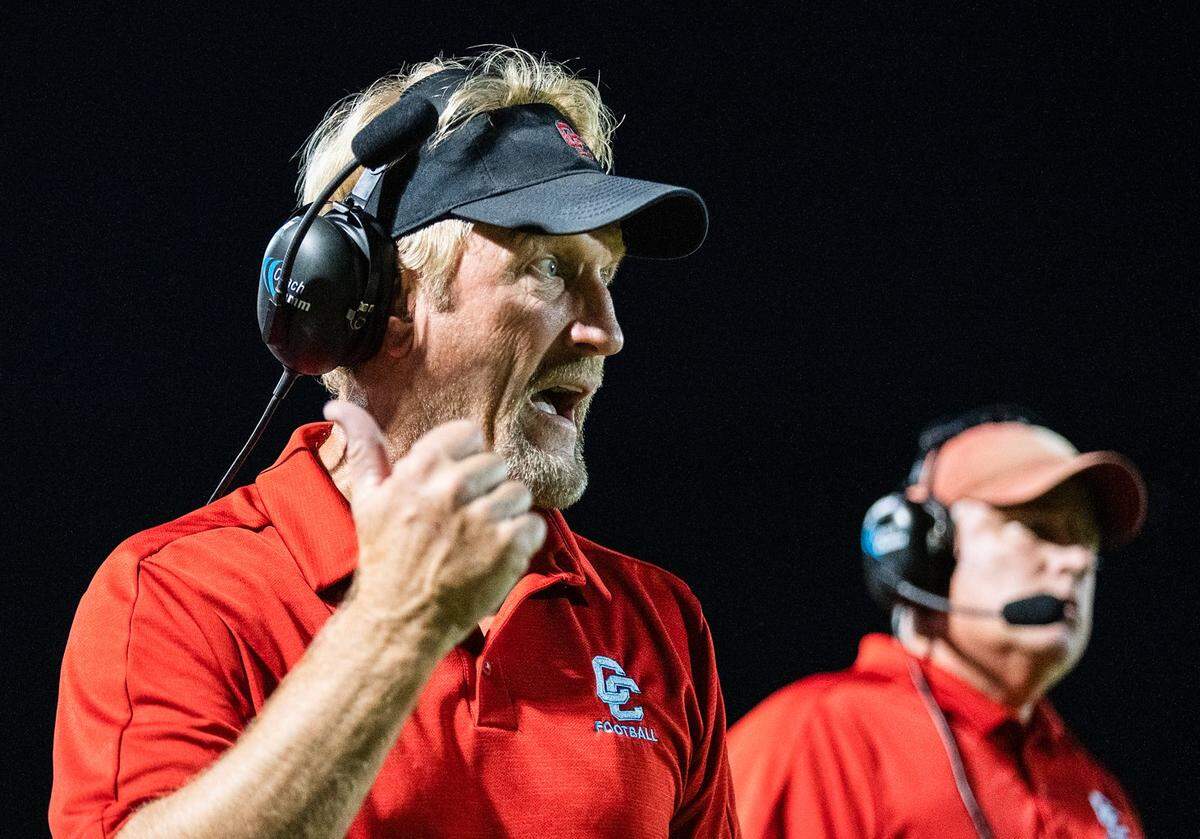 Charlotte Catholic gets the sack to end the 1st half.  head coach Mike Brodowicz (left) calls a late 2nd quarter time out.