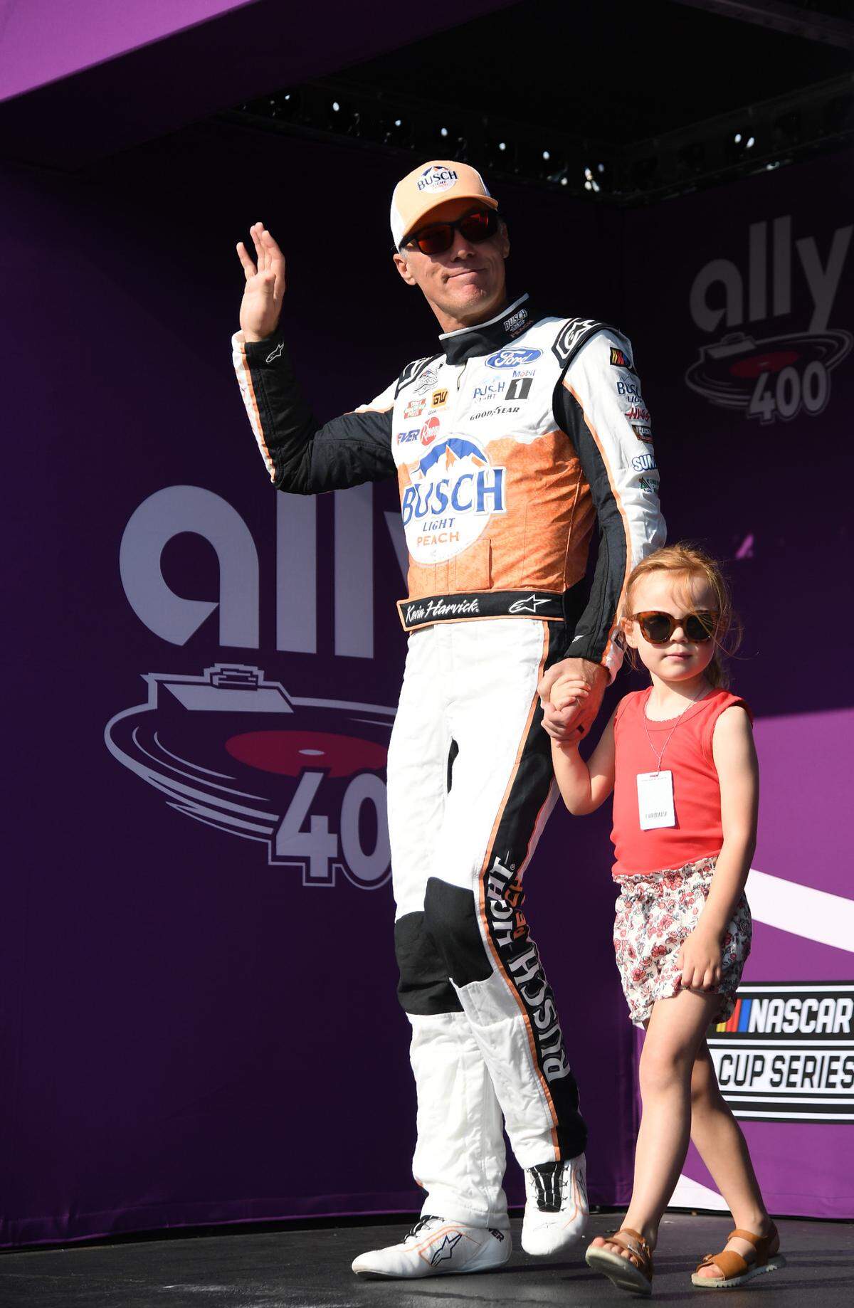 Jun 25, 2023; Nashville, Tennessee, USA; NASCAR Cup Series driver Kevin Harvick (4) crosses the stage during driver introductions before the Ally 400 at Nashville Superspeedway.