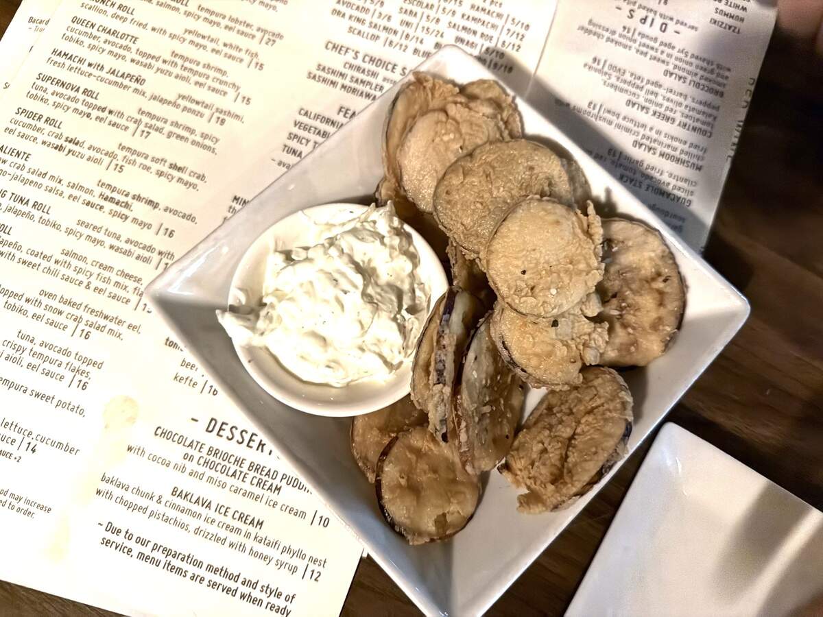 Soul Gastrolounge serves eggplant chips paired with tzatziki.