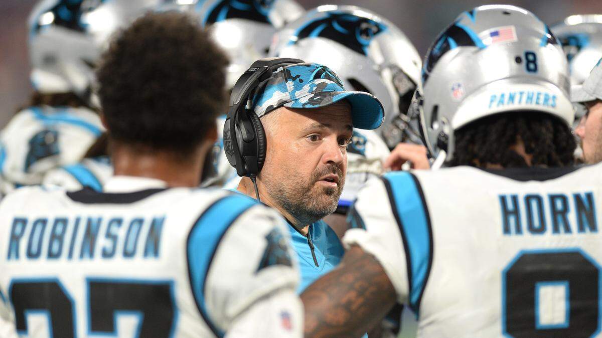 Carolina Panthers head coach Matt Rhule, center, talks with the team during a break in the action against the Buffalo Bills at Bank of America Stadium in Charlotte, NC on Friday, August 26, 2022.
