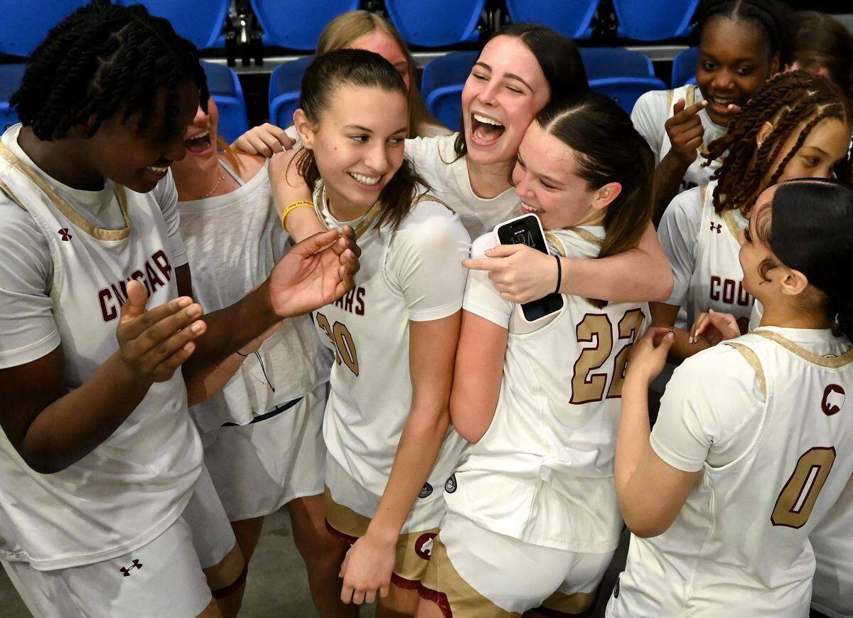 Members of the Cannon School Lady Cougars celebrate their 47-37 victory over Providence Day in the NCISAA girls state championship game with their fans on Saturday, February 28, 2026 at Novant Fieldhouse in Greensboro, NC. 