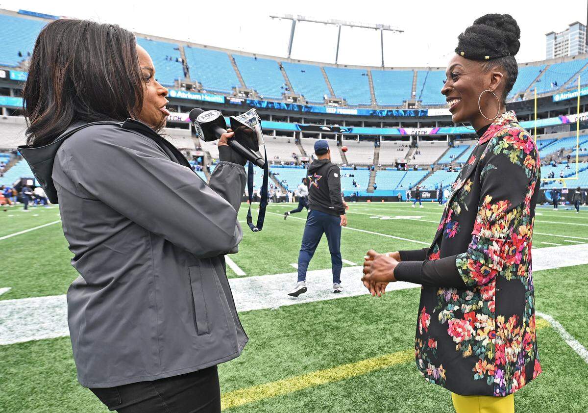 FOX Sports sideline reporter Pam Oliver, left, speaks with WSOC TV reporter DaShawn Brown right, prior to the Carolina Panthers vs Dallas Cowboys game on Sunday, October 12, 2025. Oliver is the longest tenured NFL sideline reporter with more than 500 games.