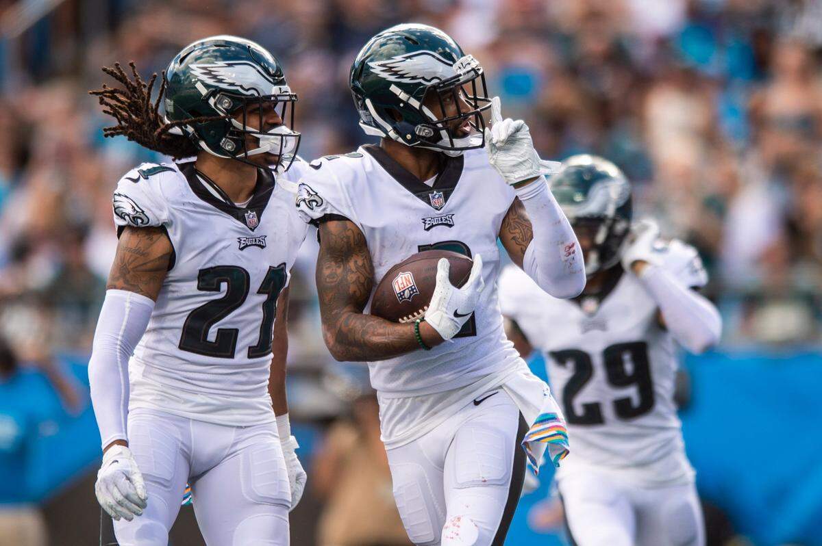 Eagles cornerback Darius Slay holds his finger to his face mask after one of his two interceptions of Sam Darnold Sunday.