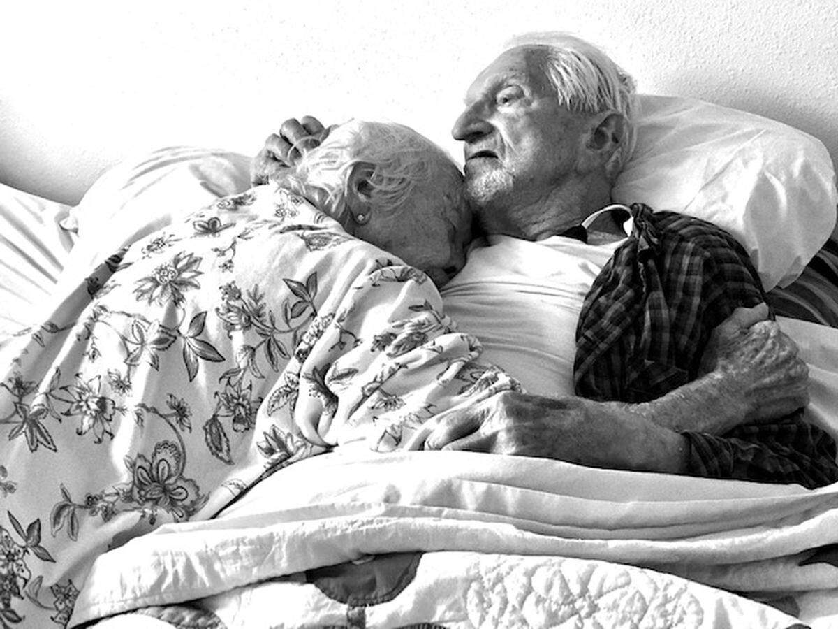 Arthur and Carole Heisler, photographed at home in bed in south Charlotte on Feb. 28 — the day before Arthur died due to complications from COVID-19 at the age of 95.