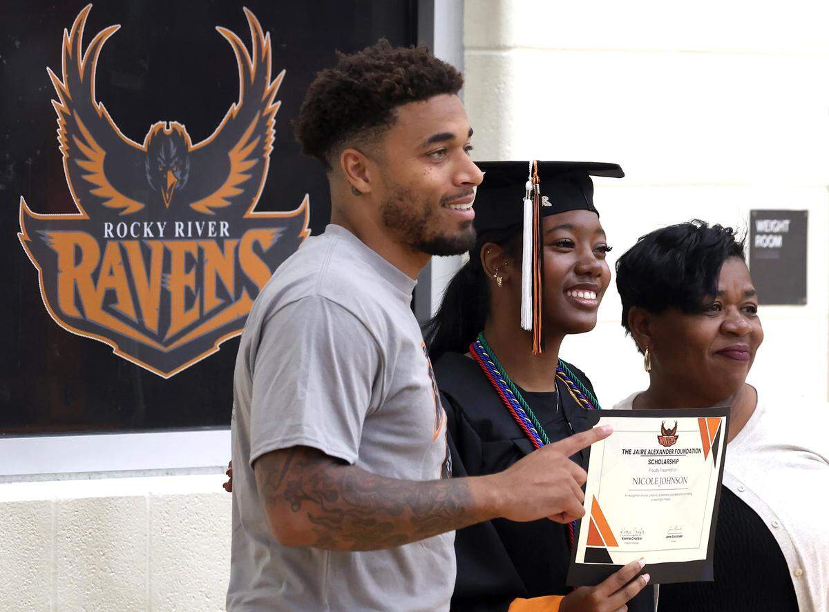 NFL defensive back Jaire Alexander's foundation presented Rocky River High School student-athlete Nicole Johnson, center, with a scholarship on Tuesday, May 19, 2026.