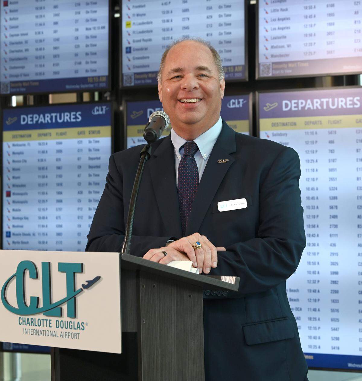 Jack Christine, chief infrastructure officer of Charlotte Douglas International Airport smiles as he and other employees celebrate its Terminal Lobby Expansion project.