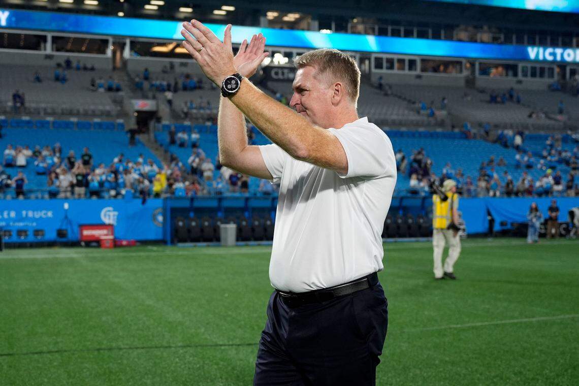 Charlotte FC head coach Dean Smith claps after a game. 