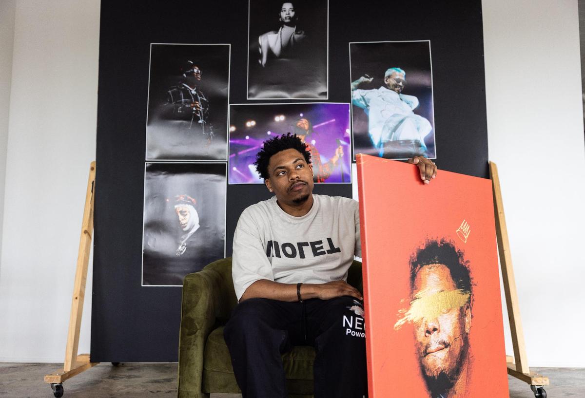 Surrounded by his photography, Charlotte artist Mike Jones said he tends to hide behind his art.