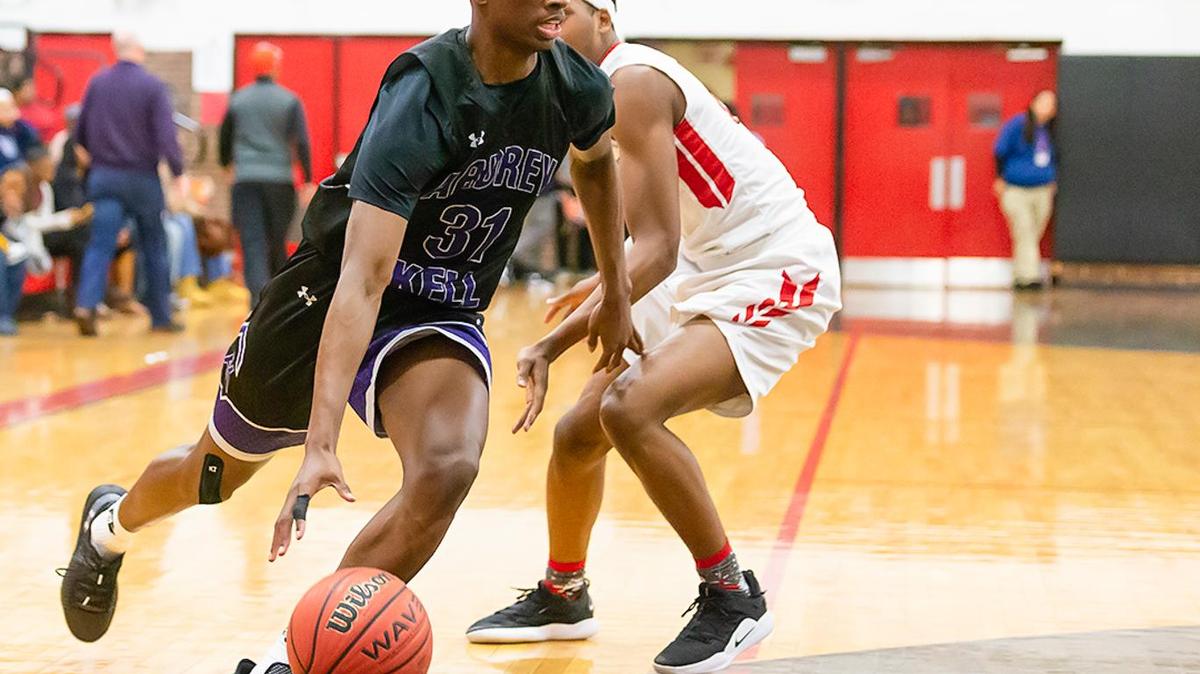 Ardrey Kell’s Christian Pickens (31) drives the baseline for the 2-point layup.