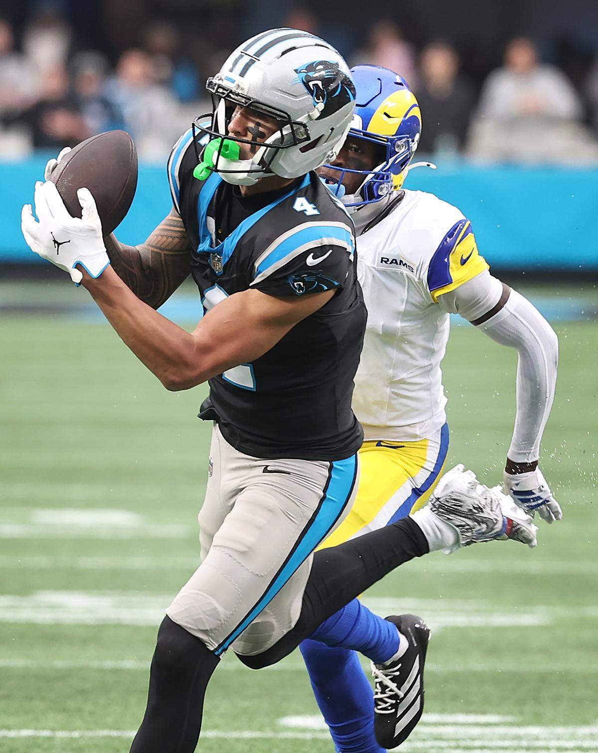 Carolina Panthers wide receiver Tetairoa McMillan catches a touchdown pass from quarterback Bryce Young during fourth quarter action against the Los Angeles Rams at Bank of America Stadium in Charlotte, NC on Sunday, November 30, 2025. The Panthers defeated the Rams 31-28.