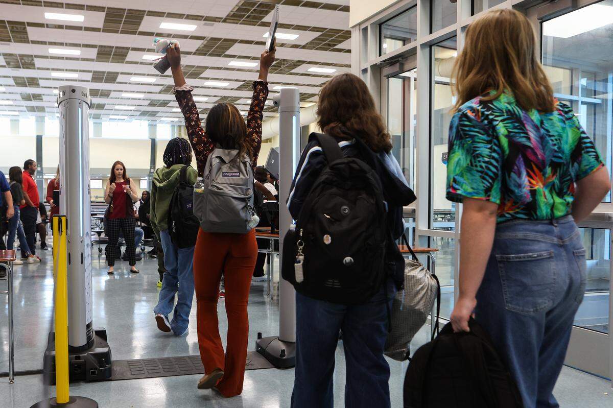 Students walk through metal detectors during the first day of school at Palisades High School, a brand new CMS campus, on Monday, August 29, 2022 in Charlotte, NC.