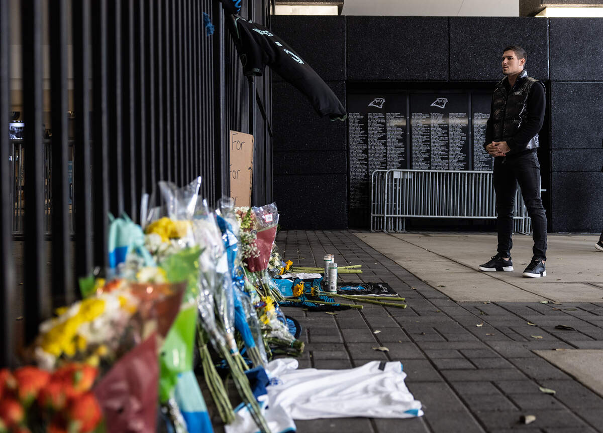 Charlotte FC goalkeeper Kristijan Kahlina stands in front of a memorial during a vigil for Charlotte FC defender Anton Walkes Charlotte, N.C., on Thursday, January 19, 2023.