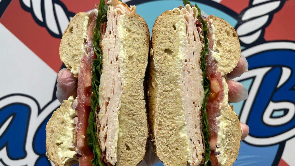 Bagel Boat’s Loaded Turkey Sandwich on a bagel comes with turkey, bacon, vegetable cream cheese, lettuce, tomato and onion.