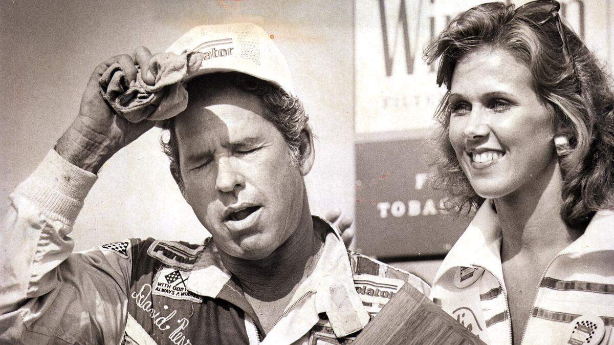 David Pearson catches his breath after winning the World 600 at Charlotte Motor Speedway in 1976. Pearson, a member of the NASCAR Hall of Fame, died at age 83 Monday.