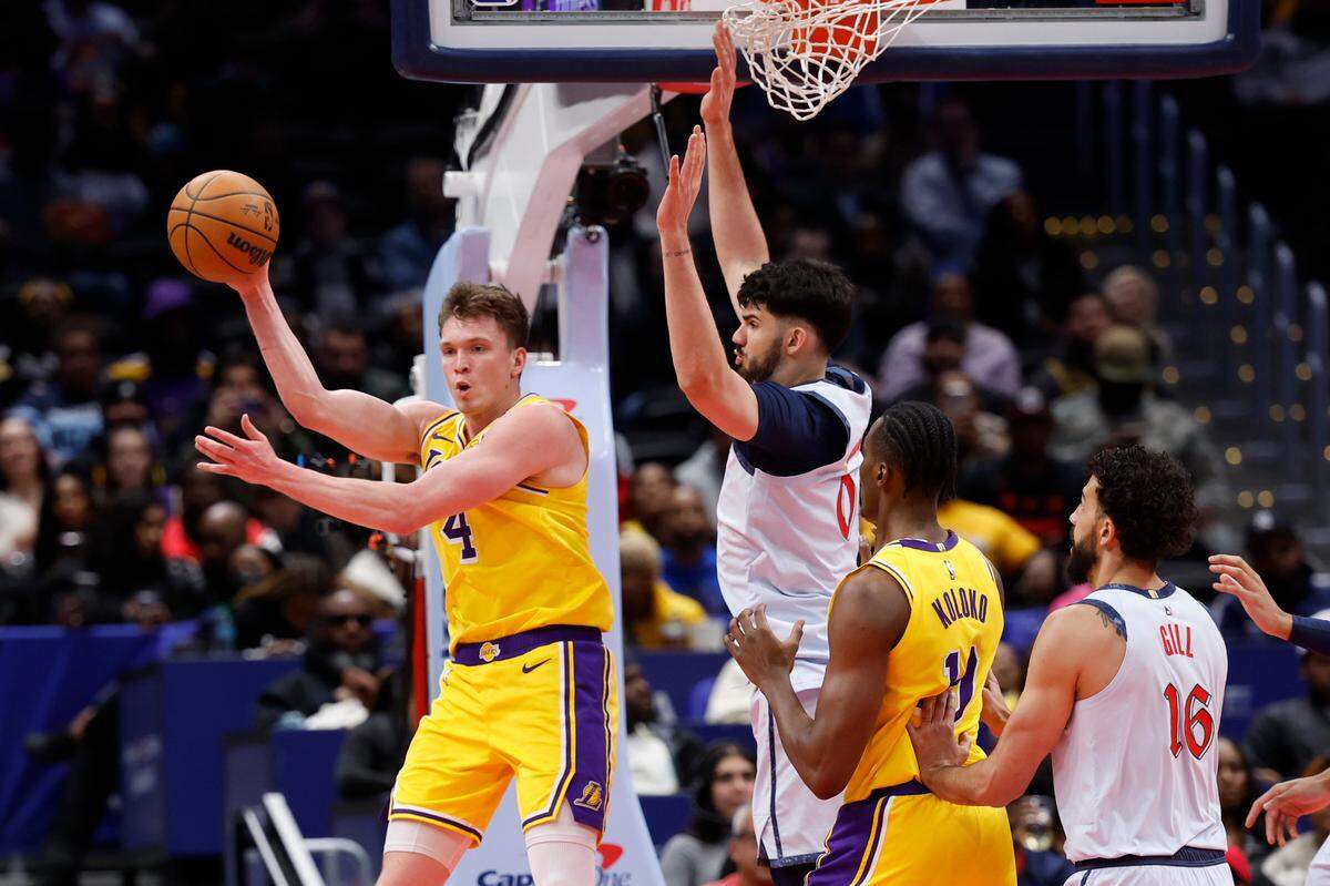 Los Angeles Lakers guard Dalton Knecht (4) passes the ball earlier this year. The Hornets could have drafted Knecht in June 2024, but passed on him at No. 6.