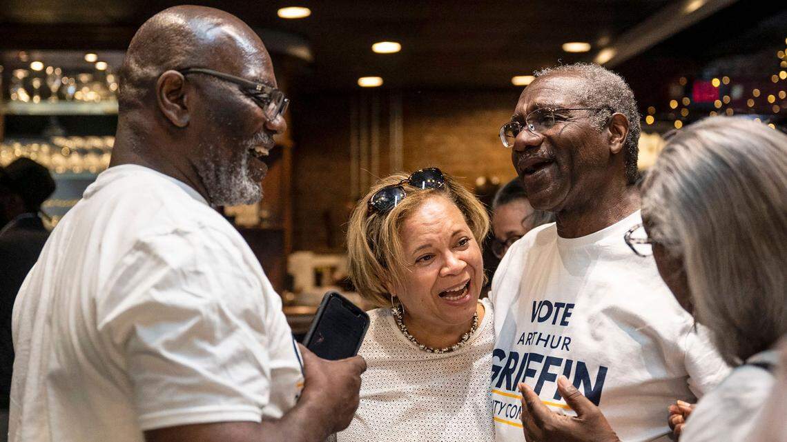 Charlotte’s Democratic incumbent mayoral candidate, Vi Lyles, second from left, speaks with George Dunlap, far left, Arthur Griffin and Dr. Wilhelmenia Rembert at the Black Political Caucus’ watch party at Studio 229 on Tuesday, May 17, 2022 in Charlotte.