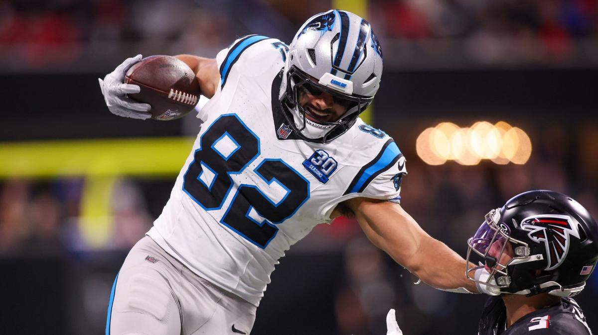 Jan 5, 2025; Atlanta, Georgia, USA; Carolina Panthers tight end Tommy Tremble (82) is pushed out of bounds by Atlanta Falcons safety Jessie Bates III (3) in overtime at Mercedes-Benz Stadium. Mandatory Credit: Brett Davis-Imagn Images