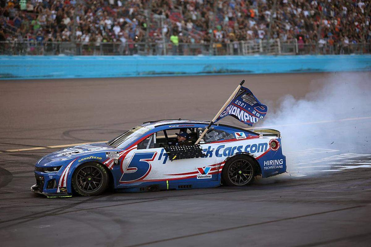 Kyle Larson, driver of the No. 5 HendrickCars.com Chevrolet, celebrates with a burnout after finishing first of the NASCAR Cup Series Championship 4 drivers to win the NASCAR Cup Series Championship at Phoenix Raceway on Nov. 2, 2025 in Avondale, Arizona.