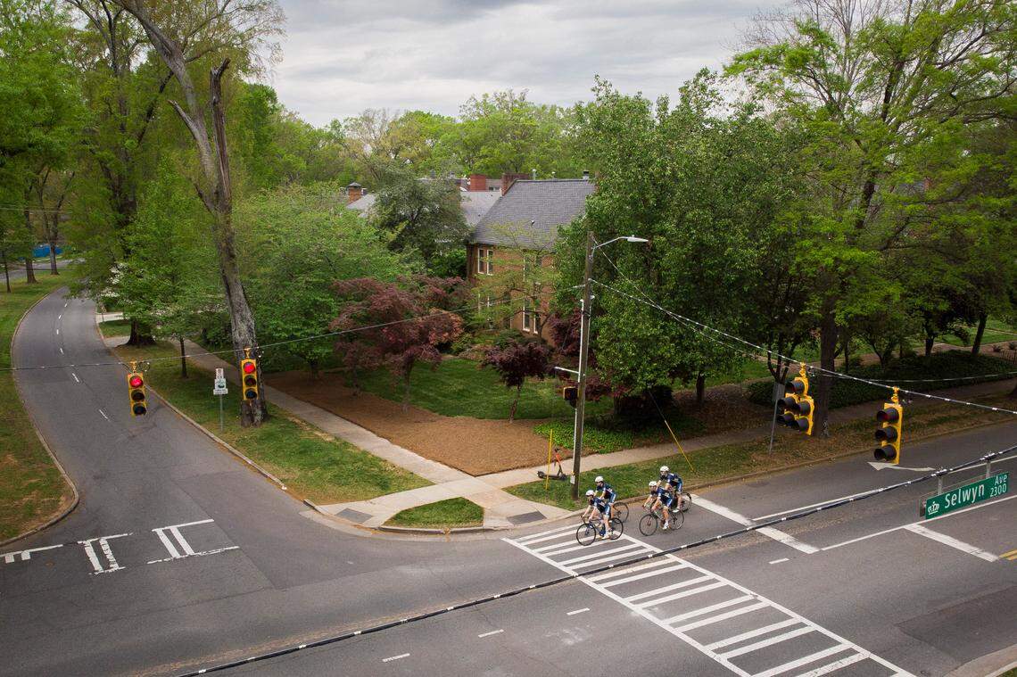 Members of the Queens University Cycling Club, including (from left) Sarka Pustova of the Czech Republic, Emma Teneza of Philadelphia, Miles Flower of Lexington, S.C., and Nils Reckemeier of Gross Berkel, Germany, ride along the Selwyn Avenue portion of the “Booty Loop.”
